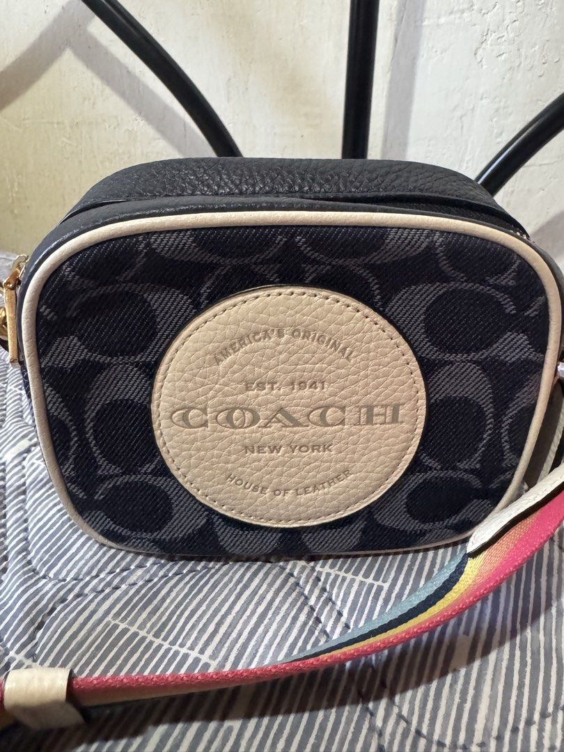 coach mini dempsey camera bag (Category: Luxury Bags & Wallets) located in Danao, Cebu. Submitted by jojie.1983 (Listing ID 1432054316, Image 3). Description: - Authentic Coach crossbody bag - Signature Coach pattern - Rainbow strap - Gold-tone hardware - Zip closure - Circular logo detail - Interior: Black - Includes small tag - Made in Cambodia.