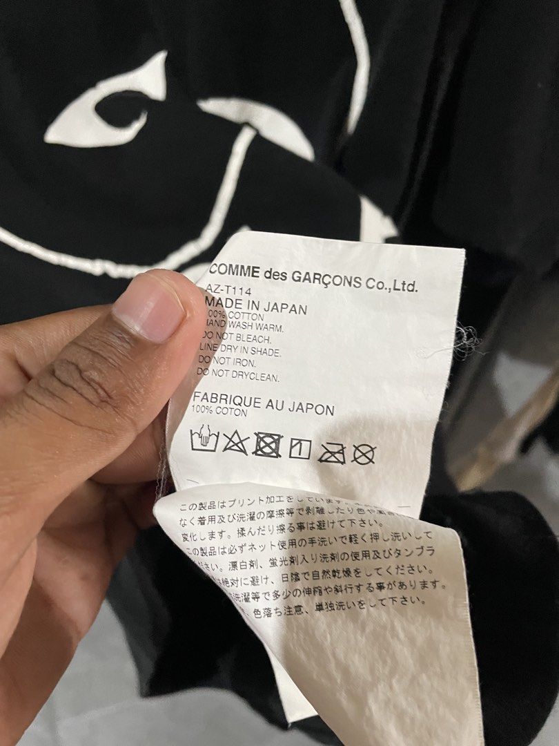 Comme des Garcons Play T-shirt - Black (Category: Shirts) located in San Fernando. Submitted by unc_thrifts (Listing ID 1432175722, Image 3). Description: - Black Comme des Garcons Play T-shirt - Iconic heart logo on the front - Crew neck and short sleeves - Size: L - Made in Japan - Material: 100% cotton.