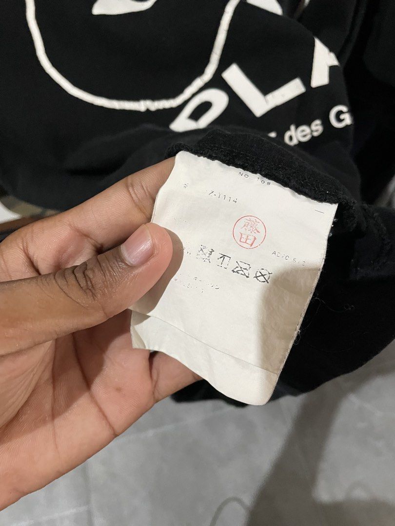 Comme des Garcons Play T-shirt - Black (Category: Shirts) located in San Fernando. Submitted by unc_thrifts (Listing ID 1432175722, Image 2). Description: - Black Comme des Garcons Play T-shirt - Iconic heart logo on the front - Crew neck and short sleeves - Size: L - Made in Japan - Material: 100% cotton.
