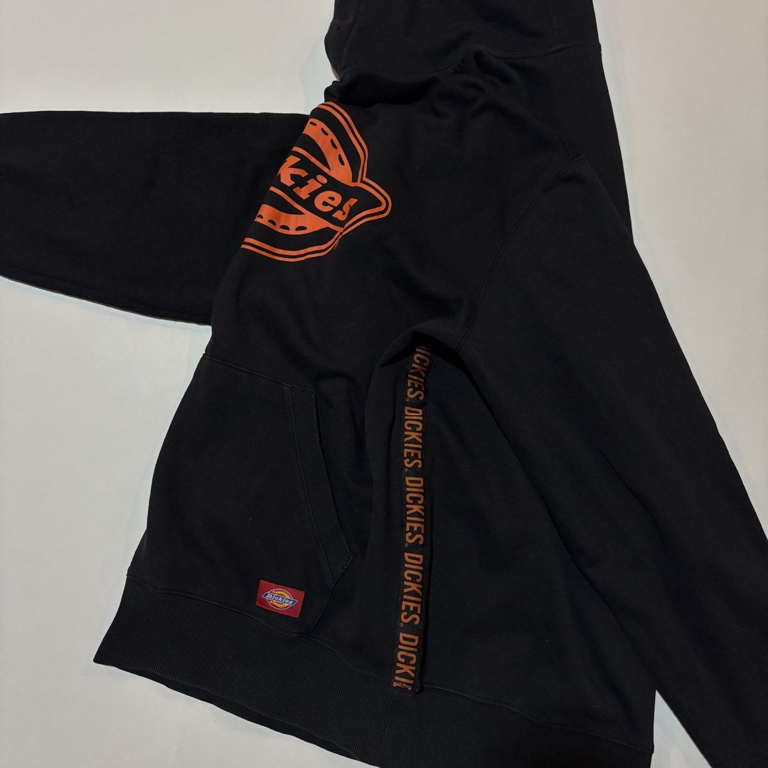 Dickies Black Hoodie (Category: Hoodies) located in Dipolog. Submitted by dionato (Listing ID 1432088237, Image 2). Description: - Black Dickies hoodie - Orange logo on front - Dickies text on sleeves - Kangaroo pocket and hood - Size: L - Made in China - Fabric: 60% cotton, 40% polyester.