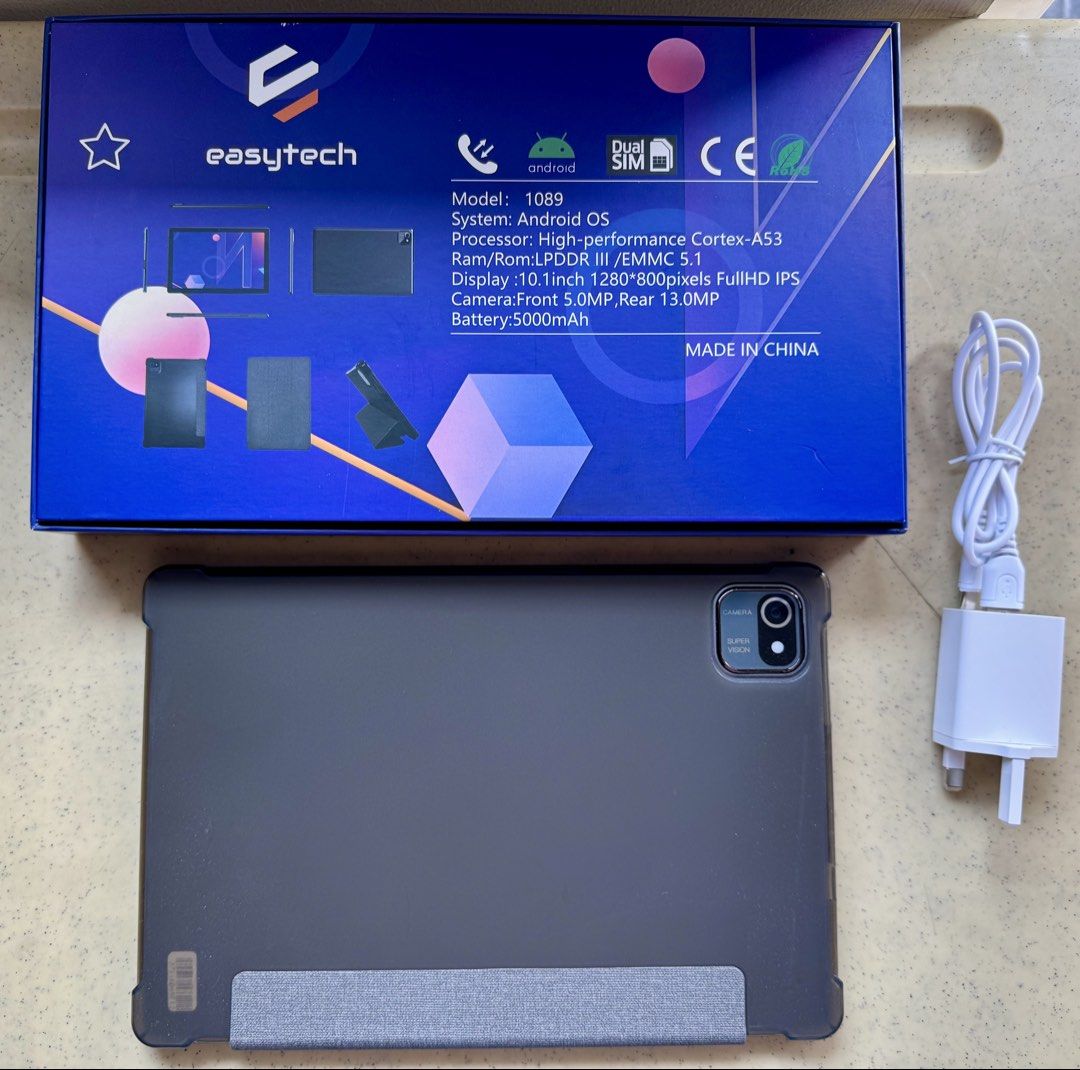 Easytech E1089 10.1-inch Tablet PC (Category: Android) located in Quezon City. Submitted by josephgab86932 (Listing ID 1432066981, Image 3). Description: Easytech E1089 10.1-inch tablet with Android OS. Features a 1280x800 pixels Full HD IPS display, 5.0MP front camera, and 13.0MP rear camera. Includes a dual SIM slot and a 5000mAh battery. Comes with a case, charger, and charging cable. Box opened just to check the product and its inclusions.
