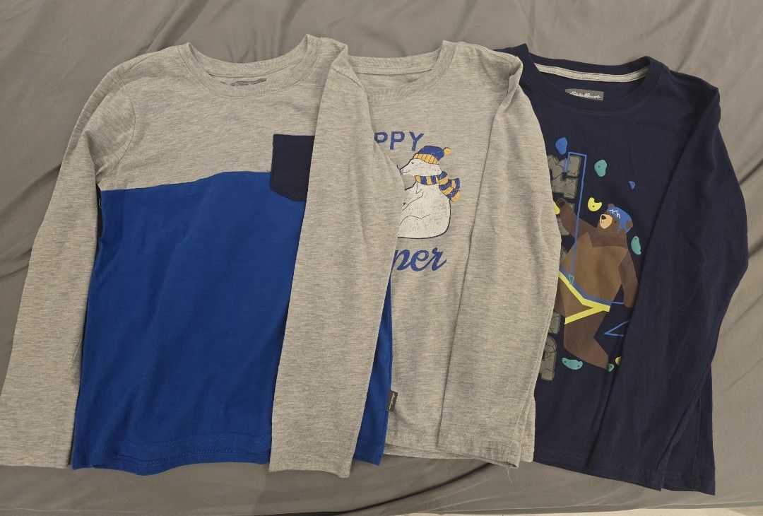Eddie Bauer Kids Long Sleeve Shirts - Bundle (Category: Babies & Kids Fashion) located in Valenzuela. Submitted by lgenn (Listing ID 1432100360, Image 1). Description: - Bundle of three Eddie Bauer long sleeve shirts. - Includes: - Gray and blue shirt - Gray shirt with "Happy Camper" graphic - Navy blue shirt with "Eddie Bauer" graphic - Size: S (7/8) - Condition: Good.