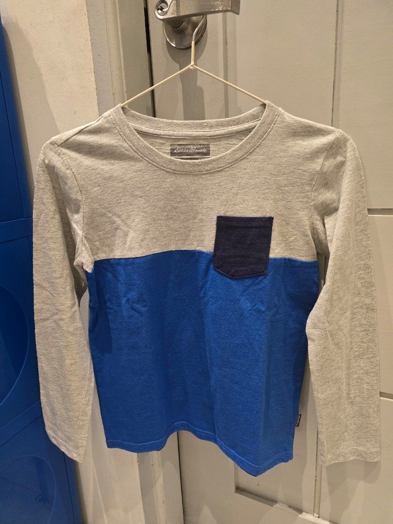 Eddie Bauer Kids Long Sleeve Shirts - Bundle (Category: Babies & Kids Fashion) located in Valenzuela. Submitted by lgenn (Listing ID 1432100360, Image 2). Description: - Bundle of three Eddie Bauer long sleeve shirts. - Includes: - Gray and blue shirt - Gray shirt with "Happy Camper" graphic - Navy blue shirt with "Eddie Bauer" graphic - Size: S (7/8) - Condition: Good.