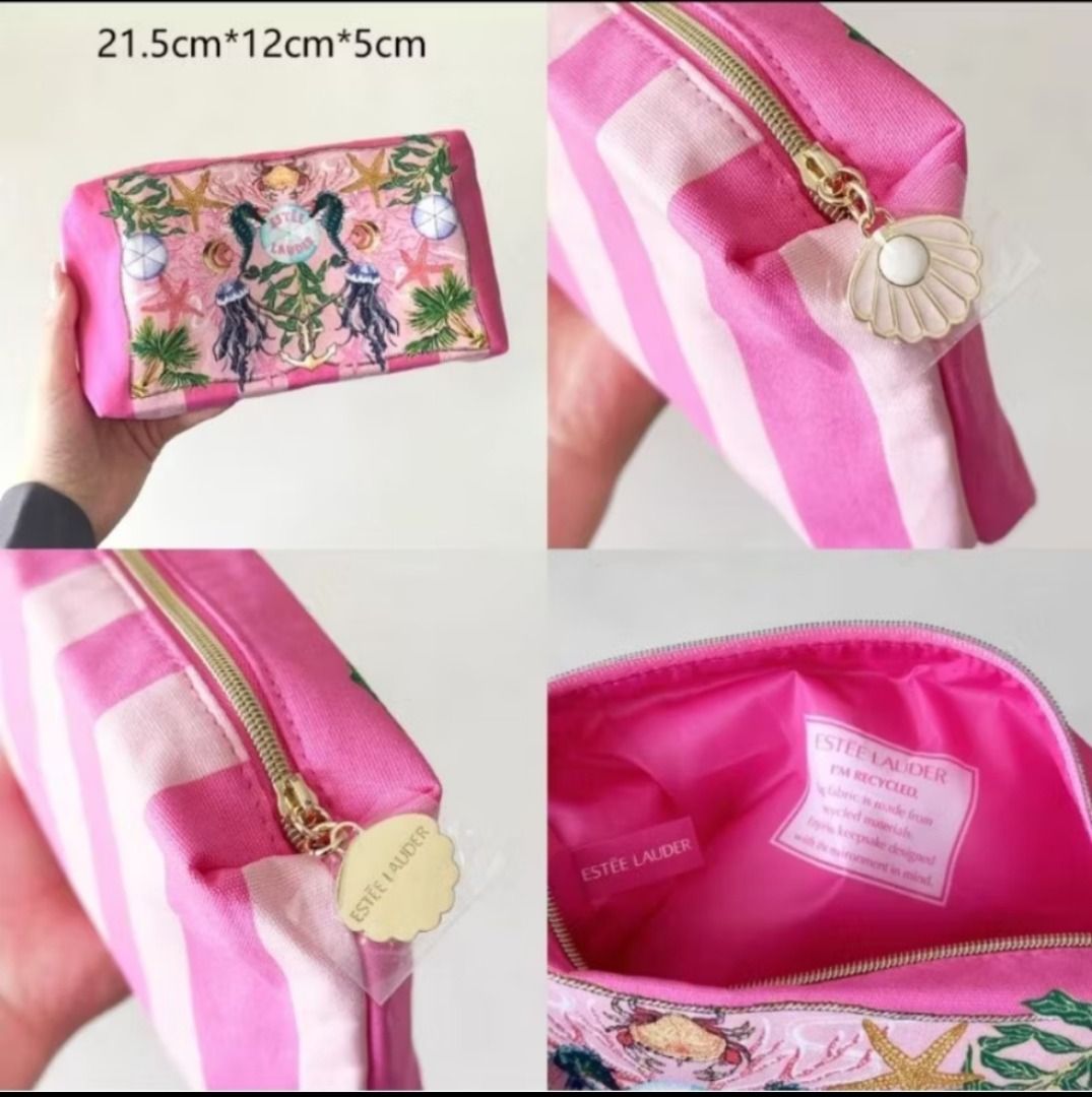 Estee Lauder Cosmetic Bag SUMMER BEACH pouch (Category: Purses & Pouches) located in Manila. Submitted by PureWonder_Shop (Listing ID 1432101035, Image 1). Description: ESTEE LAUDER cosmetic pouch bag - Pink and white striped design - Seashell zipper pull - Vibrant pink interior - Sea-themed embroidery on front panel - Made from recycled materials ✨ Dimensions: Approximately 21.5cm x 12cm x 5cm 🧁 FREE SF METRO MANILA ONLY.