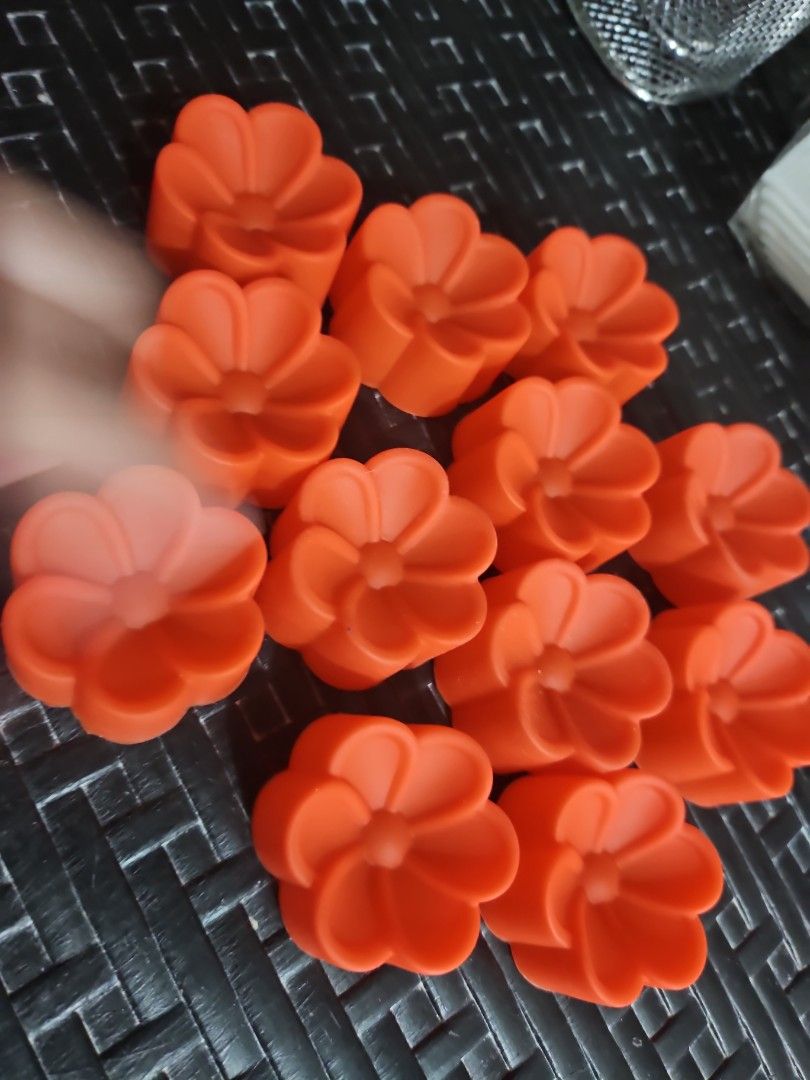 Flower-Shaped Silicone Molds (Category: Bakeware) located in Manila. Submitted by just_about_anything (Listing ID 1432136992, Image 1). Description: Create beautiful crafts with these orange, flower-shaped silicone molds! Perfect for soaps, candles, and more. Flexible, durable, and easy to clean..