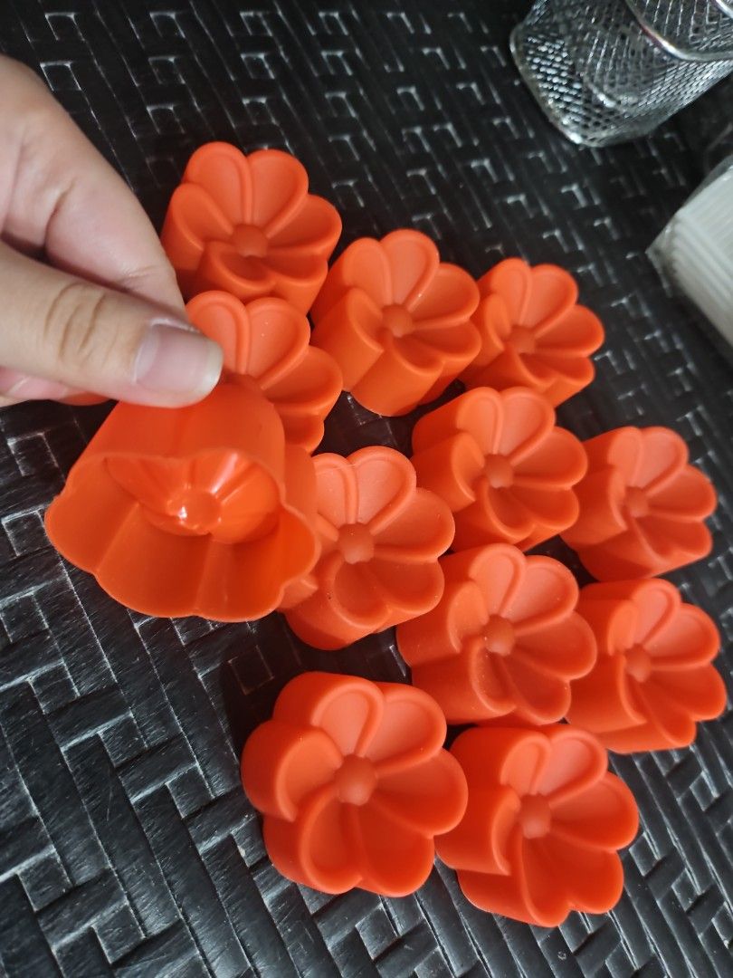 Flower-Shaped Silicone Molds (Category: Bakeware) located in Manila. Submitted by just_about_anything (Listing ID 1432136992, Image 2). Description: Create beautiful crafts with these orange, flower-shaped silicone molds! Perfect for soaps, candles, and more. Flexible, durable, and easy to clean..