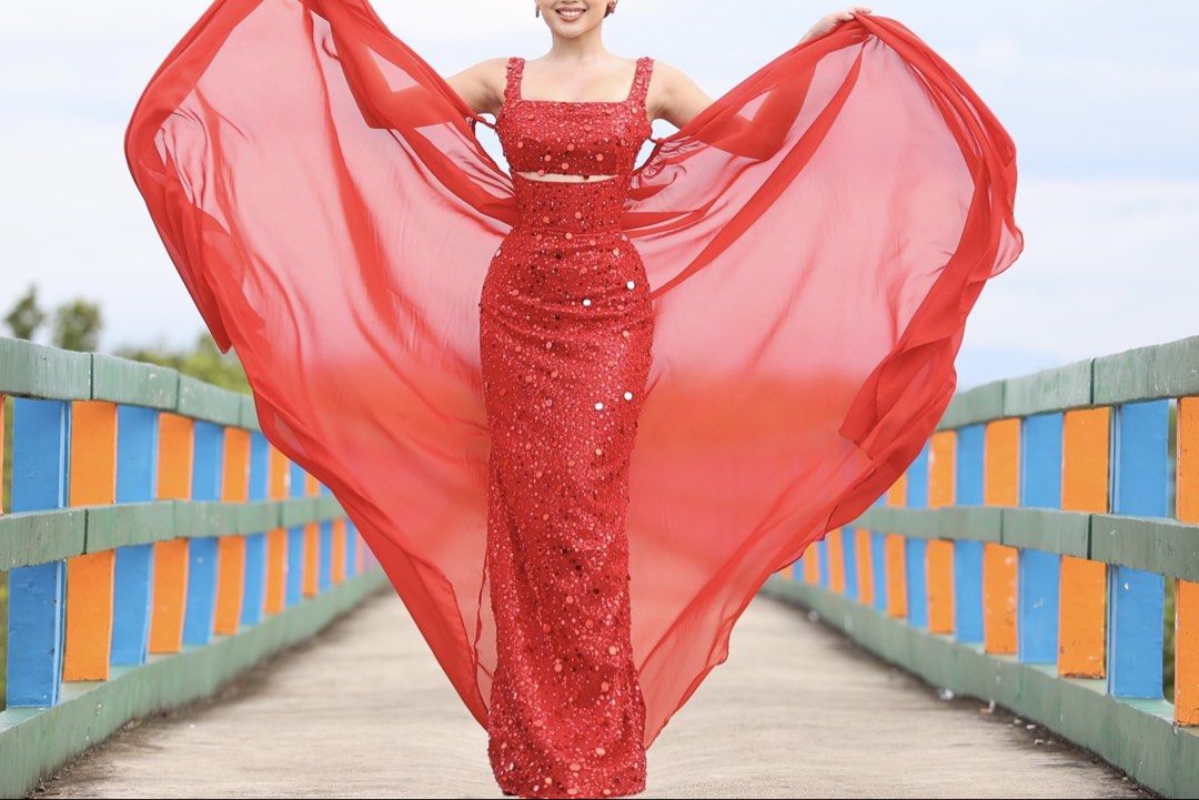 [For Rent] Red Sequin Evening Gown with Cape (Category: Evening dresses & gowns) located in Taguig. Submitted by wornbyangela (Listing ID 1432054304, Image 2). Description: - Red sequin evening gown - Fitted bodice with cutout - Floor-length skirt - Matching sheer cape included (can be removed if needed) - Ideal for formal events and special occasions - Designed to make a statement.