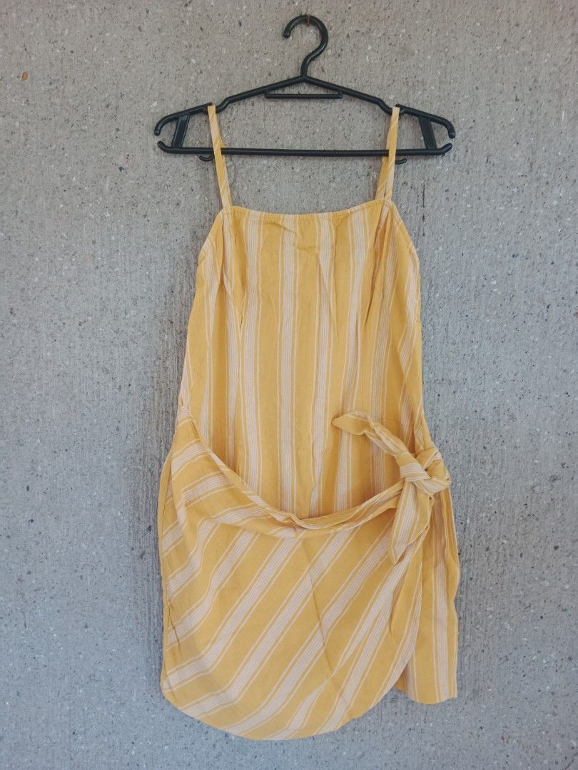 Forever 21 Striped Wrap Dress - Size L (Category: Dresses) located in Batangas. Submitted by purplesummer_ph (Listing ID 1432033362, Image 1). Description: - Forever 21 dress - Size: L - Design: Wrap style - Color: Yellow and white stripes - Closure: Tie waist and back zipper - Straps: Adjustable spaghetti straps.