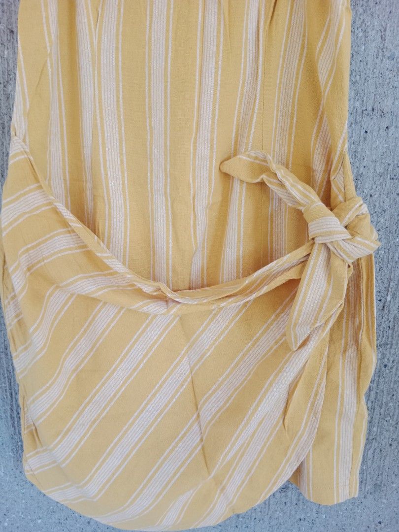 Forever 21 Striped Wrap Dress - Size L (Category: Dresses) located in Batangas. Submitted by purplesummer_ph (Listing ID 1432033362, Image 2). Description: - Forever 21 dress - Size: L - Design: Wrap style - Color: Yellow and white stripes - Closure: Tie waist and back zipper - Straps: Adjustable spaghetti straps.