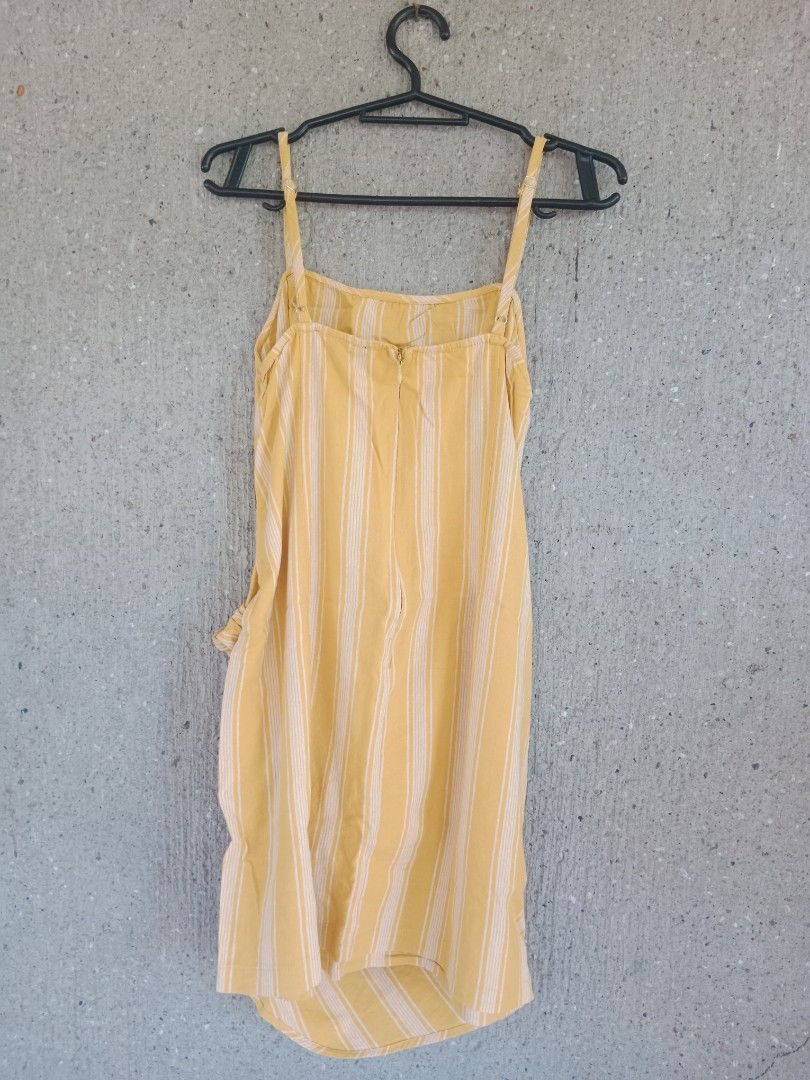 Forever 21 Striped Wrap Dress - Size L (Category: Dresses) located in Batangas. Submitted by purplesummer_ph (Listing ID 1432033362, Image 3). Description: - Forever 21 dress - Size: L - Design: Wrap style - Color: Yellow and white stripes - Closure: Tie waist and back zipper - Straps: Adjustable spaghetti straps.