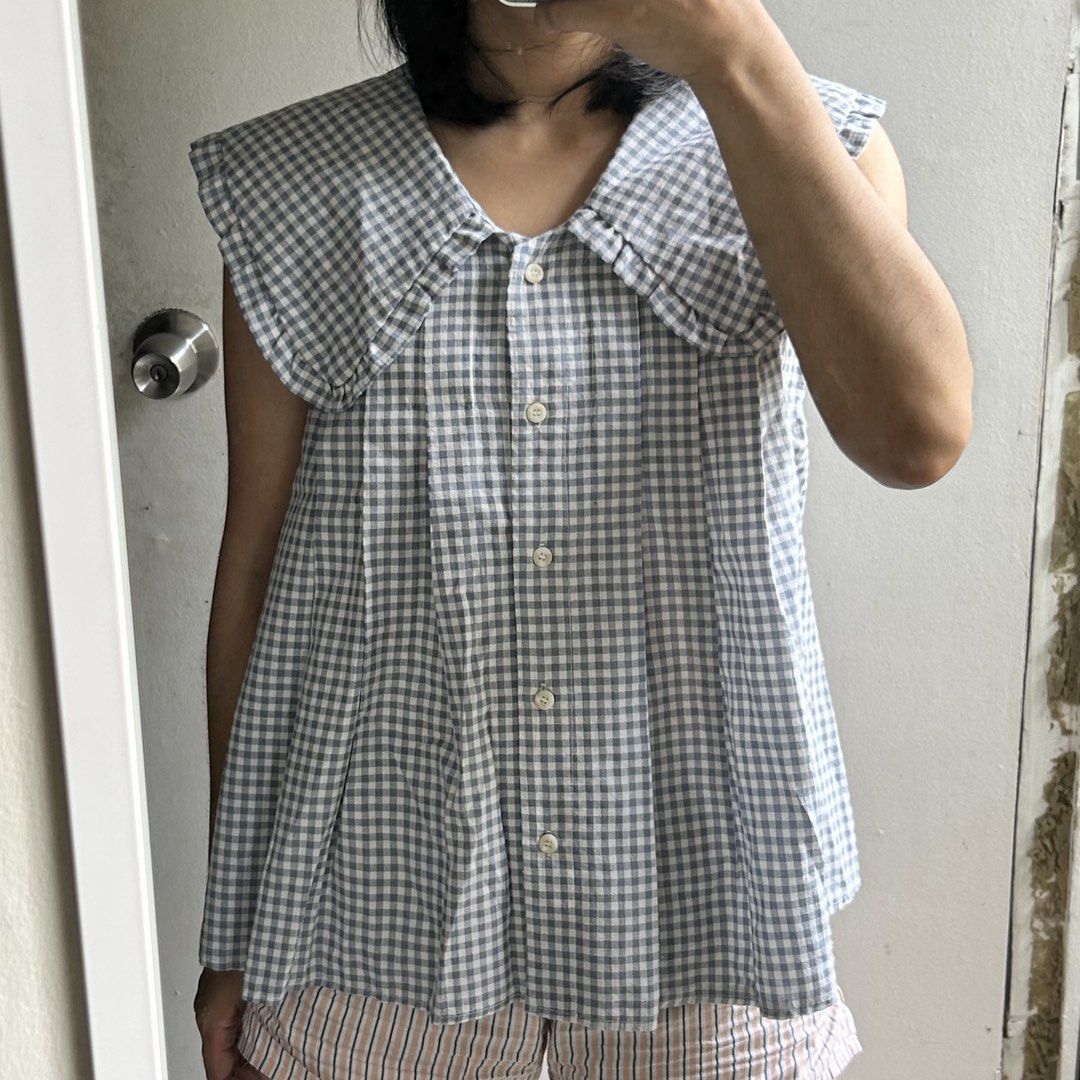 Gingham Sleeveless Top with Peter Pan Collar (Category: Blouses) located in Quezon City. Submitted by p0lingkit (Listing ID 1432080994, Image 2). Description: - Sleeveless gingham top - Classic blue and white pattern - Peter Pan collar - Button-down front - Lightweight fabric - Relaxed fit.