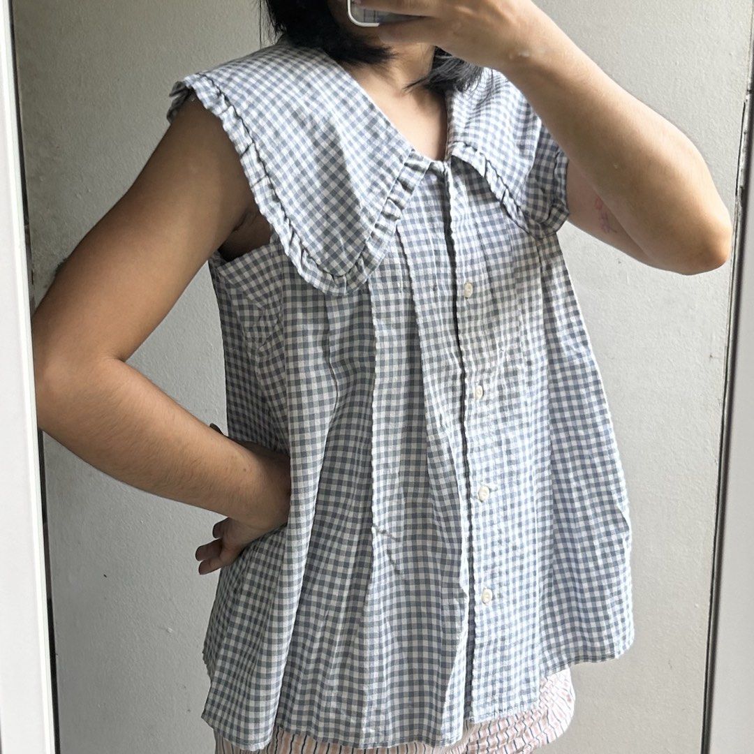 Gingham Sleeveless Top with Peter Pan Collar (Category: Blouses) located in Quezon City. Submitted by p0lingkit (Listing ID 1432080994, Image 3). Description: - Sleeveless gingham top - Classic blue and white pattern - Peter Pan collar - Button-down front - Lightweight fabric - Relaxed fit.