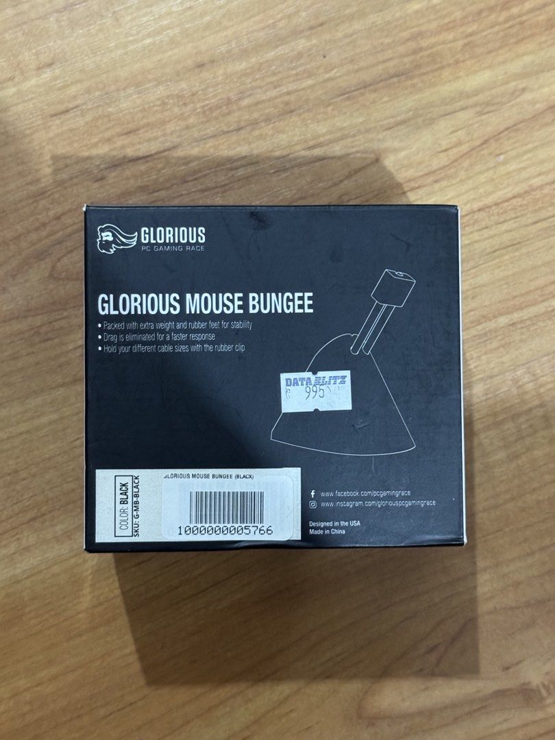 Glorious Mouse Bungee (Black) (Category: Mouse & Mousepads) located in Manila. Submitted by rickyspade (Listing ID 1432119411, Image 1). Description: - Improves gaming performance by eliminating mouse cable drag. - Features extra weight and rubber feet for stability. - Compatible with various cable sizes. - Comes in black color..