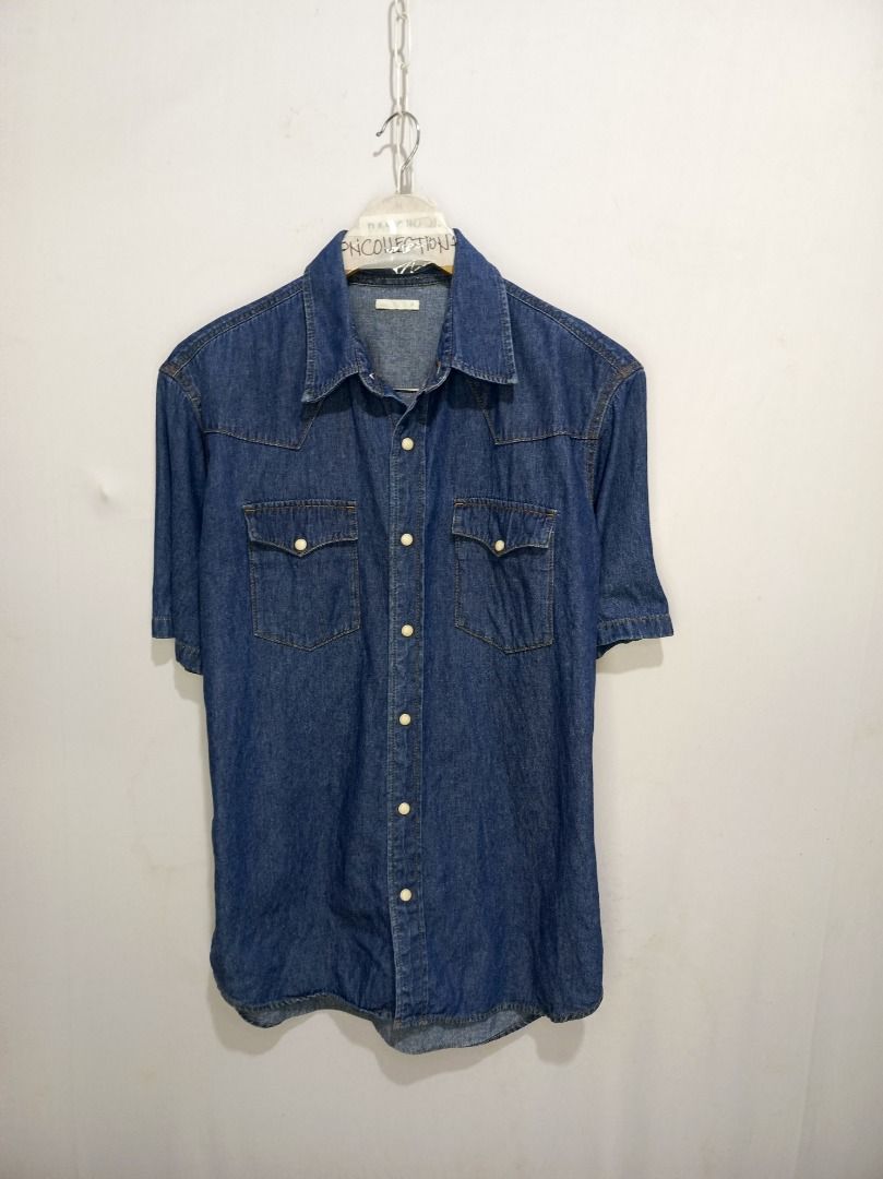 GU Denim Short Sleeve Shirt (Category: Shirts) located in Balamban. Submitted by pncollectionph (Listing ID 1432119796, Image 2). Description: - GU Denim Short Sleeve Shirt - Size: M - Color: Classic Blue Denim - Material: 100% Cotton - Features: Two chest pockets, button closures - Measurements: 20.5 x 29.