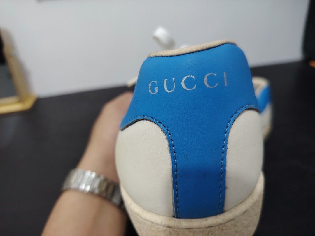 Gucci Donald Duck Sneakers (Category: Sneakers) located in Angeles City. Submitted by daruwinoru7 (Listing ID 1432166904, Image 3). Description: - Gucci Donald Duck Sneakers - White leather upper - Blue heel tab - Donald Duck graphic on the side - Gucci branding on heel and insole - Signs of wear on soles - Size visible on insole - White laces.