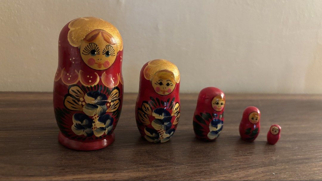 Hand-painted Russian Nesting Dolls and Cat Figurine (Category: Other Home Decor) located in Antipolo. Submitted by beastman032180 (Listing ID 1432028775, Image 1). Description: - Hand-painted Russian nesting dolls - Vibrant red color - Intricate floral designs with gold accents - Hand-painted cat figurine - Yellow base with floral details - Black stripes - Cat in sitting position - Unique collectible item.
