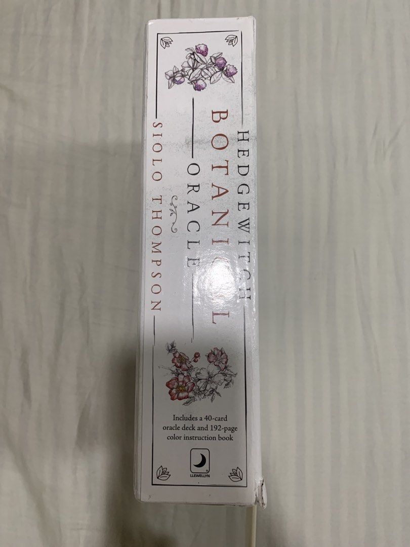 Hedge Witch Botanical Oracle Deck by Siolo Thompson (Category: Storybooks) located in Taguig. Submitted by plum21x (Listing ID 1432069291, Image 2). Description: - Complete 40-card oracle deck - 192-page color instruction book - Box has dents but contents (book and cards) are like new - accidentally bought two copies so I’m selling this one.