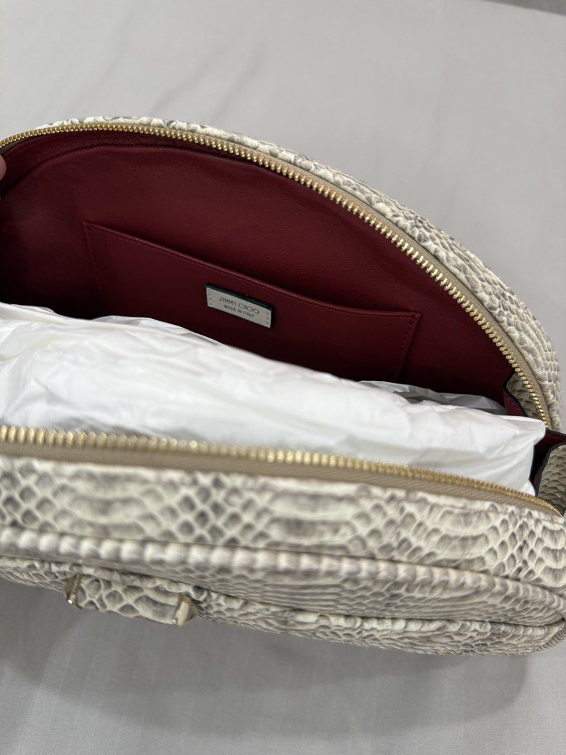 Jimmy Choo snakeskin-print leather pouch (Category: Purses & Pouches) located in Bulacan. Submitted by kallyseconds (Listing ID 1432036014, Image 3). Description: Avenue Quilted Snakeskin-Print Leather Pouch Jimmy Choo “Avenue” curve pouch in snakeskin-print leather with diagonal quilting Brand new With dust bag Zip top closure Front metal logo Interior, one slip pocket Lining: Leather Trim: Leather Approx. 6.7”H x 11.5”W x 2.8”D Weight: 0.65 lbs