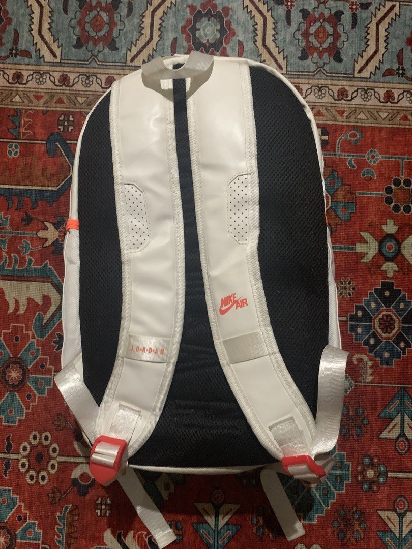 Jordan 6 retro Backpack White (Category: Backpacks) located in Cagayan de Oro. Submitted by chabermz (Listing ID 1432172825, Image 2). Description: - White Jordan backpack with black and orange accents. - Front zip pocket for easy access. - Comfortable padded shoulder straps. - Convenient top handle. - Breathable mesh back panel. - Features Jordan logo on the front. - Includes Nike Air logo..