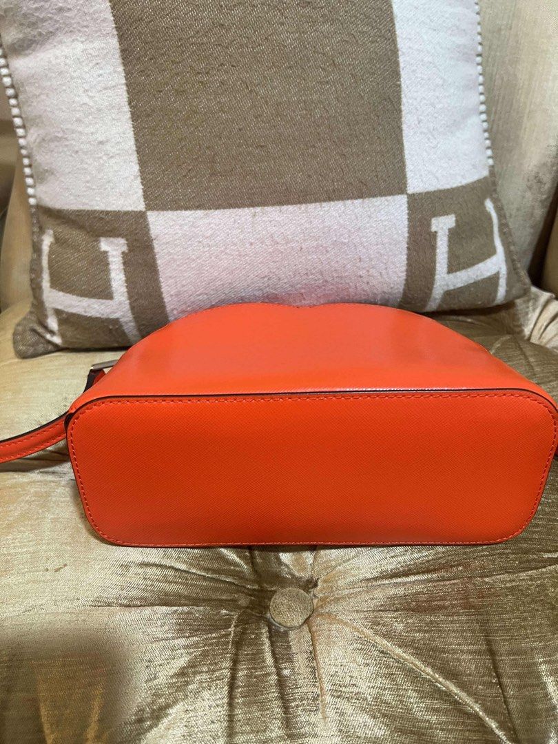 Kate Spade Orange Crossbody Bag (Category: Luxury Bags & Wallets) located in Las Pinas. Submitted by marivel17 (Listing ID 1432166357, Image 3). Description: - Bright orange Kate Spade crossbody bag - Zip closure - Heart-shaped design on front - Light-colored interior lining - Small interior pocket - Long strap for shoulder or crossbody wear - Authentic Kate Spade.
