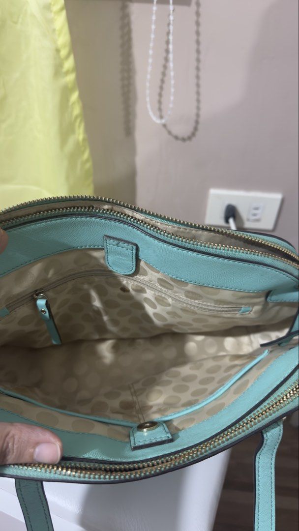 Kate Spade Satchel Handbag (Category: Shoulder Bags) located in Bulacan. Submitted by lovedthingsetc (Listing ID 1432136717, Image 3). Description: - Authentic Kate Spade handbag from the US - Light blue/teal color - Zip closure - Double handles - Spacious interior with pocket - Features the Kate Spade logo.
