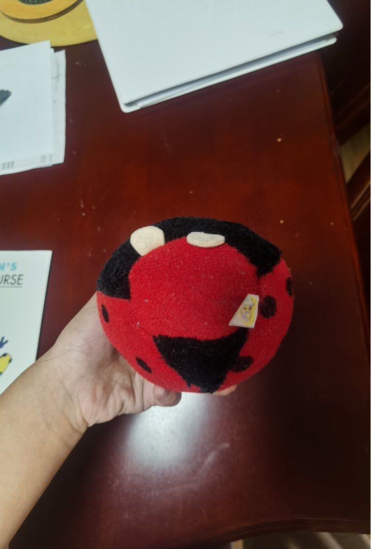 Ladybug Plush Toy (Category: Plushies & Soft Toys) located in Quezon City. Submitted by angcham (Listing ID 1432098015, Image 1). Description: - Adorable ladybug plush toy - Red and black color scheme - Features small black spots - Soft and cuddly material - Round shape with black head and red antennae - Suitable for kids and collectors.
