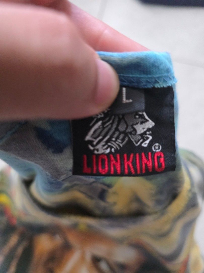 Lion King Bob Marley Tank Top - Large (Category: Activewear) located in Mandaluyong City. Submitted by arayko (Listing ID 1432014426, Image 3). Description: - Lion King tank top with vibrant tie-dye design. - Features a Bob Marley graphic on the front. - Tie-dye pattern on the back with Bob Marley logo. - Size: Large - Classic sleeveless design. Width- 19.5" Length- 28.5".