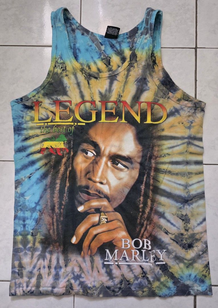 Lion King Bob Marley Tank Top - Large (Category: Activewear) located in Mandaluyong City. Submitted by arayko (Listing ID 1432014426, Image 1). Description: - Lion King tank top with vibrant tie-dye design. - Features a Bob Marley graphic on the front. - Tie-dye pattern on the back with Bob Marley logo. - Size: Large - Classic sleeveless design. Width- 19.5" Length- 28.5".
