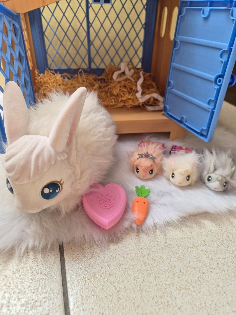 Little Live Pets Mama Surprise Bunny Set (Category: Kids Toys) located in Quezon City. Submitted by hapiyumi (Listing ID 1432006803, Image 1). Description: Little Live Pets Mama Surprise set - Includes: - White bunny with blue eyes - Hutch with blue roof and door - Baby bunnies - Accessories (carrot, heart-shaped toy) - Complete set - Ready for play!.