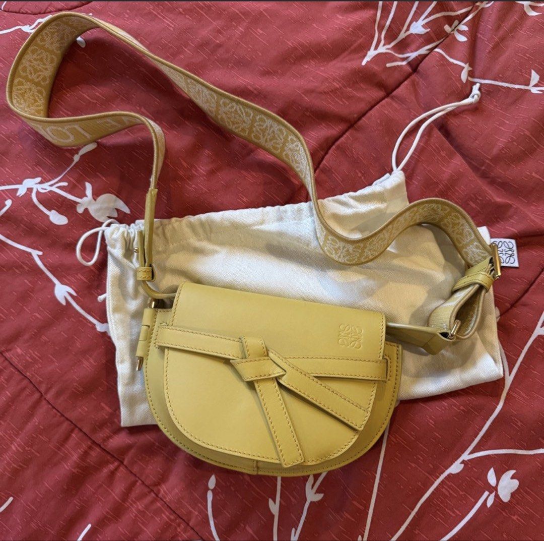 Loewe Gate Mini Bag Yellow (Category: Luxury Bags & Wallets) located in Quezon City. Submitted by prebyp (Listing ID 1432144871, Image 1). Description: - Authentic Loewe Gate Mini Bag - Eye-catching yellow color - Signature bow detail on the front - Adjustable strap with Loewe logo - Luxurious suede interior lining - Secure magnetic closure - Comes with original dust bag.