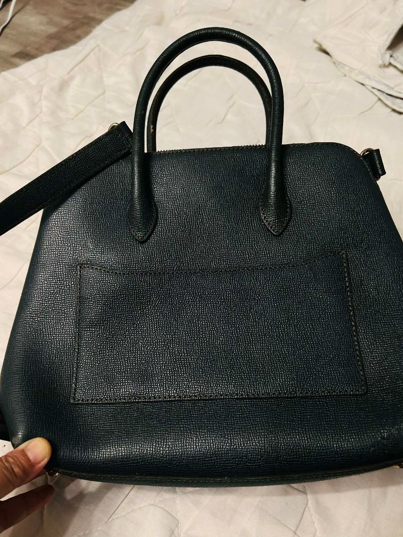 Louis Quatorze Black Handbag (Category: Luxury Bags & Wallets) located in Batangas. Submitted by selahs-closet (Listing ID 1432161989, Image 2). Description: Black handbag from Louis Quatorze. Features a top handle design with a zip closure. Includes a small tag and gold-toned hardware. The interior has a zip pocket..