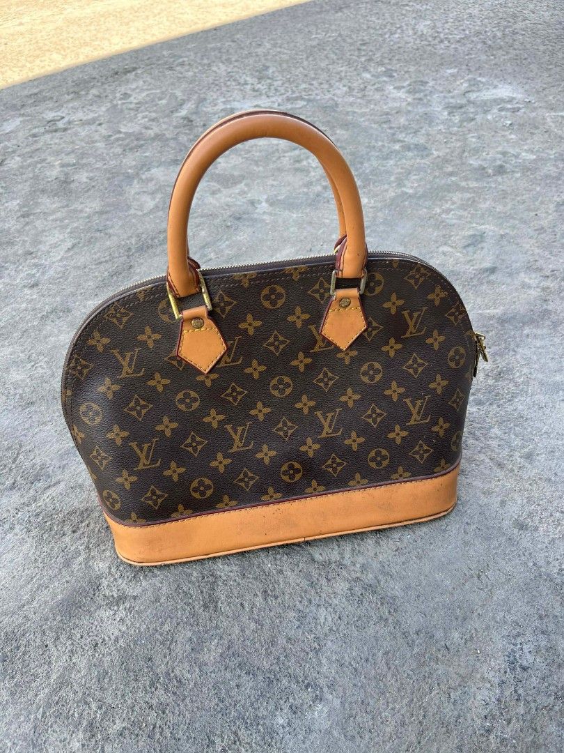 Louis Vuitton Alma Handbag (Category: Luxury Bags & Wallets) located in Manila. Submitted by lasonthrift.27 (Listing ID 1432081383, Image 1). Description: - Authentic Louis Vuitton Alma handbag - Iconic monogram canvas - Brown leather trim and handles - Top zip closure - Spacious interior - Structured and elegant design - Perfect for everyday or special occasions - A timeless luxury piece.