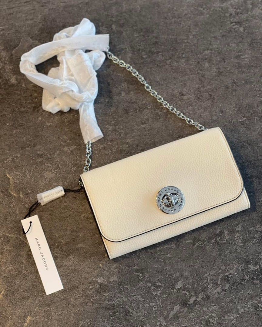 Marc Jacobs Cream Chain Wallet (Category: Luxury Bags & Wallets) located in Caloocan City. Submitted by Roowchelly (Listing ID 1432160160, Image 1). Description: - Brand new Marc Jacobs chain wallet - Cream color - Silver chain strap - Circular clasp with Marc Jacobs logo - Includes original tag - Unused condition.