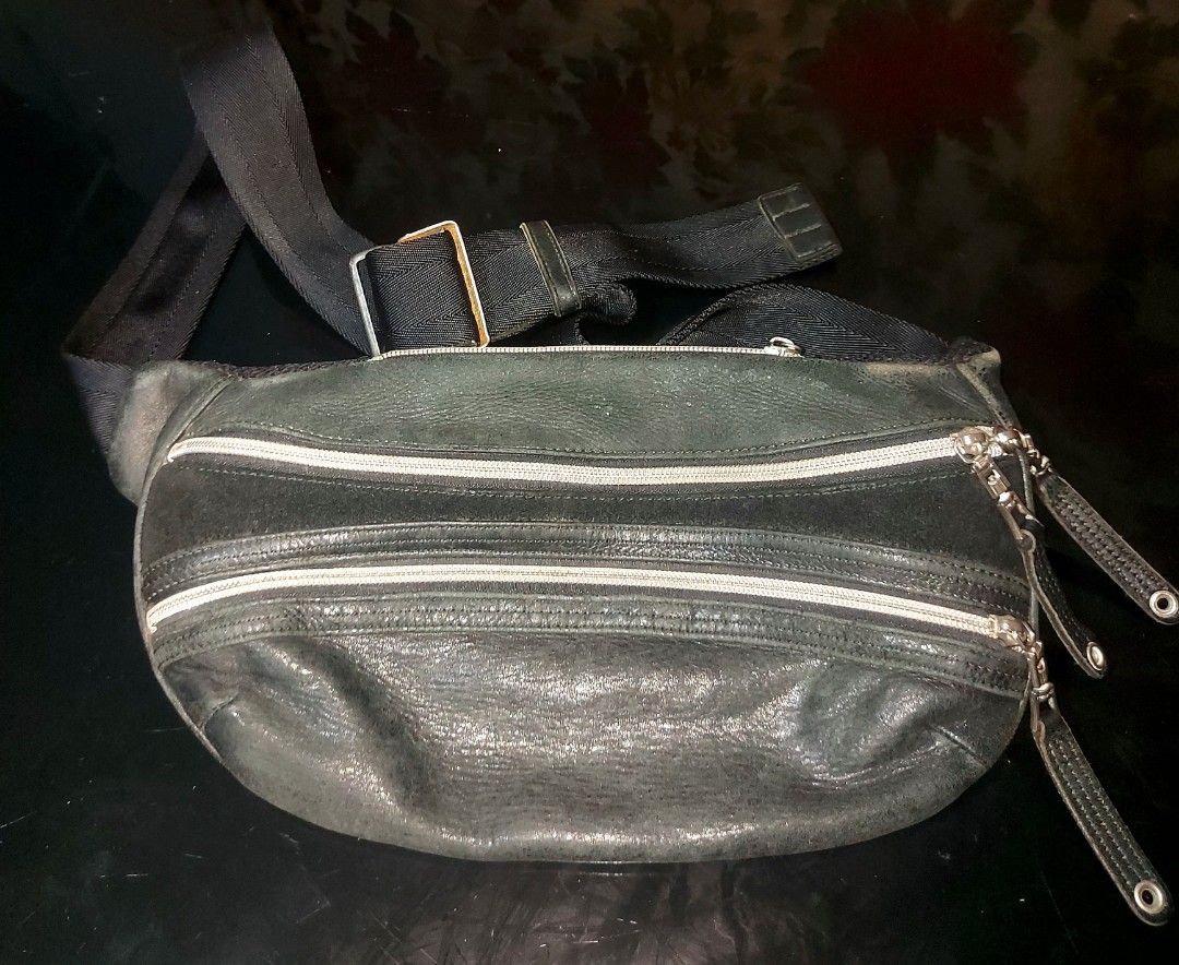 Master-Piece Black Waist Bag (Category: Belt bags, Clutches and Pouches) located in Quezon City. Submitted by jdlzhen01 (Listing ID 1432174670, Image 1). Description: - Master-Piece black waist bag - Multiple zippered compartments - Adjustable strap - Made of leather and nylon - Patterned interior lining - Made in Japan - Buckle closure - Metal hardware.