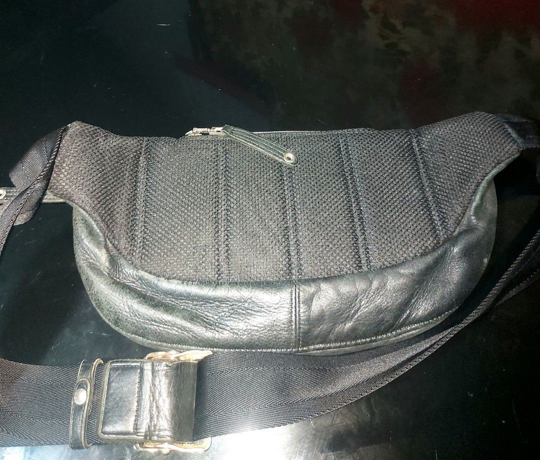 Master-Piece Black Waist Bag (Category: Belt bags, Clutches and Pouches) located in Quezon City. Submitted by jdlzhen01 (Listing ID 1432174670, Image 2). Description: - Master-Piece black waist bag - Multiple zippered compartments - Adjustable strap - Made of leather and nylon - Patterned interior lining - Made in Japan - Buckle closure - Metal hardware.