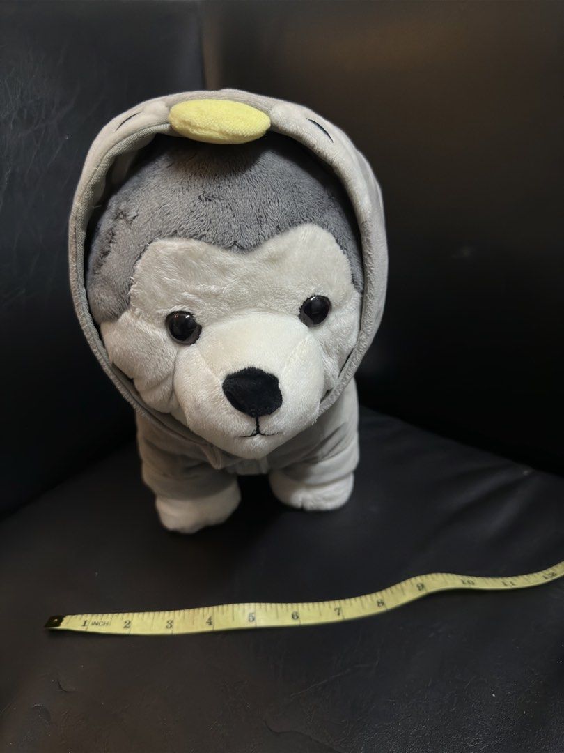 Miniso Husky Plush Toy (Category: Plushies & Soft Toys) located in Manila. Submitted by dxcluttering. (Listing ID 1432181942, Image 1). Description: - Adorable Miniso husky plush toy - Features a gray hoodie - White face and paws with black eyes and nose - Measures 36cm/14.2in - Soft and cuddly material - Perfect for kids and collectors.