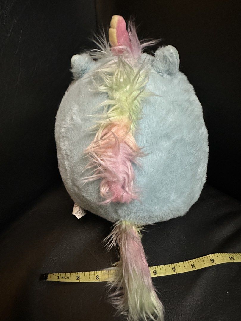 Miniso Penguin Unicorn Plush Toy (Category: Plushies & Soft Toys) located in Manila. Submitted by dxcluttering. (Listing ID 1432182259, Image 2). Description: - Miniso penguin plush toy. - Features a unicorn costume. - Light blue body with pink and yellow horn. - Rainbow tail. - Approximately 28cm (8.7 inches) tall. - Soft and cuddly material. - Ideal for kids and collectors..