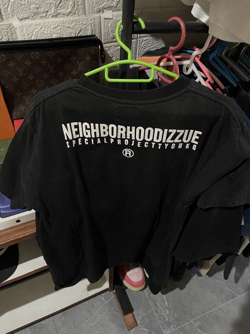 Neighborhood IZZUE (Category: Tshirts & Polo Shirts ) located in San Fernando. Submitted by unc_thrifts (Listing ID 1432175465, Image 1). Description: - Black t-shirt - White Neighborhood Dizzy print on the back - Crew neck - Short sleeves - Print includes "SPECIAL PROJECT TYOHKG" and registered trademark symbol.