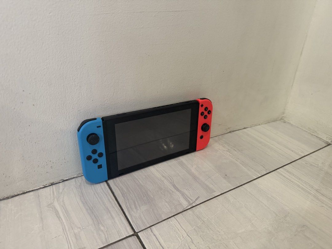 Nintendo Switch 1 with Games and Wireless Controller (Category: Nintendo) located in Paranaque City. Submitted by ryankhloe77 (Listing ID 1432038051, Image 3). Description: Price is Negotiable ✅ Includes: - Nintendo Switch Console - Nintendo Switch Deck - Red and blue Joy-Cons - Joy Con Grip - Joy Con Straps - Charging cable - HDMI Cable Also Included: 🎮🕹️ - Three game cartridges: Just Dance 2021, Pokemon Scarlet, and Mario & Sonic at the Olymp