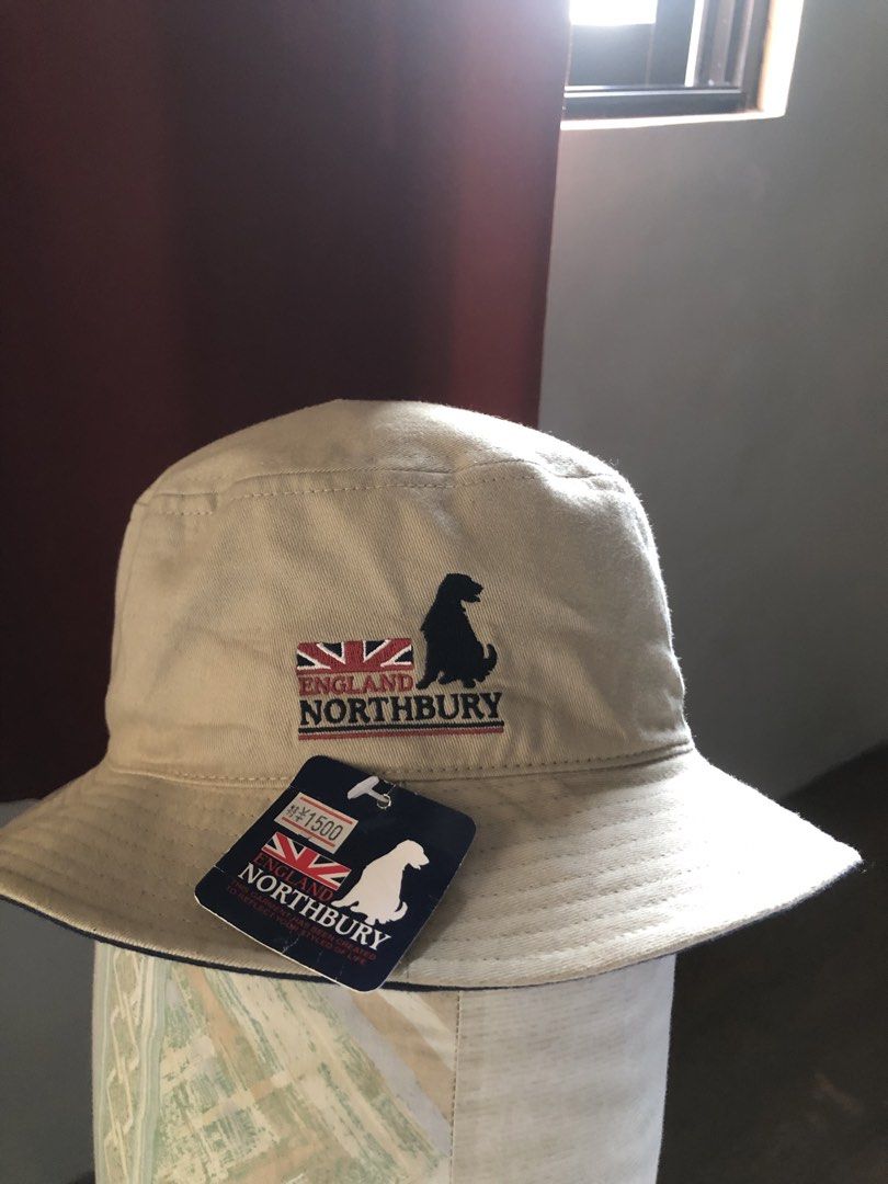 Northbury England Bucket Hat (Category: Caps & Hats) located in Pasig City. Submitted by maricrism68145 (Listing ID 1432179783, Image 1). Description: - Northbury bucket hat - Material: 100% Cotton - Design: Dog logo and England flag - Reversible: Black interior - Size: 58cm (Free Size) - Care: Wash at 30 degrees - Origin: Made in China.