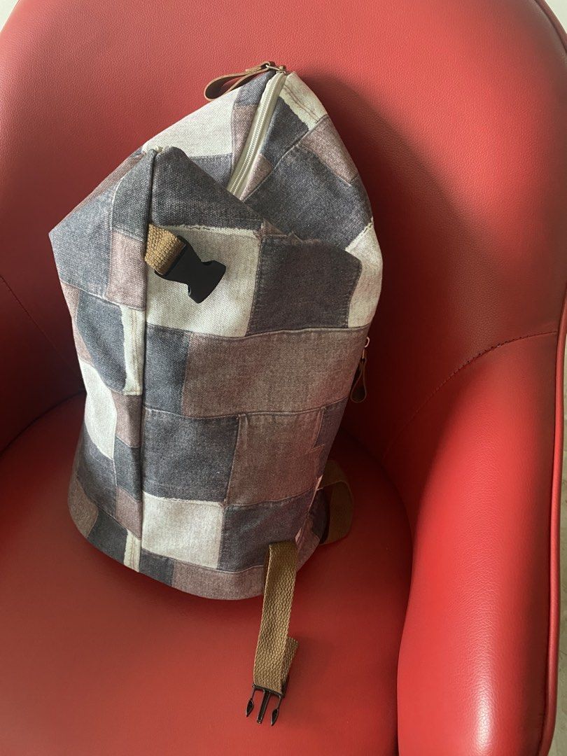Patchwork Backpack (Category: Backpacks) located in Singapore. Submitted by msgj_mum (Listing ID 1432030788, Image 5). Description: - Stylish patchwork design - Multiple compartments - Adjustable straps - Secure buckle closure - Versatile neutral tones.