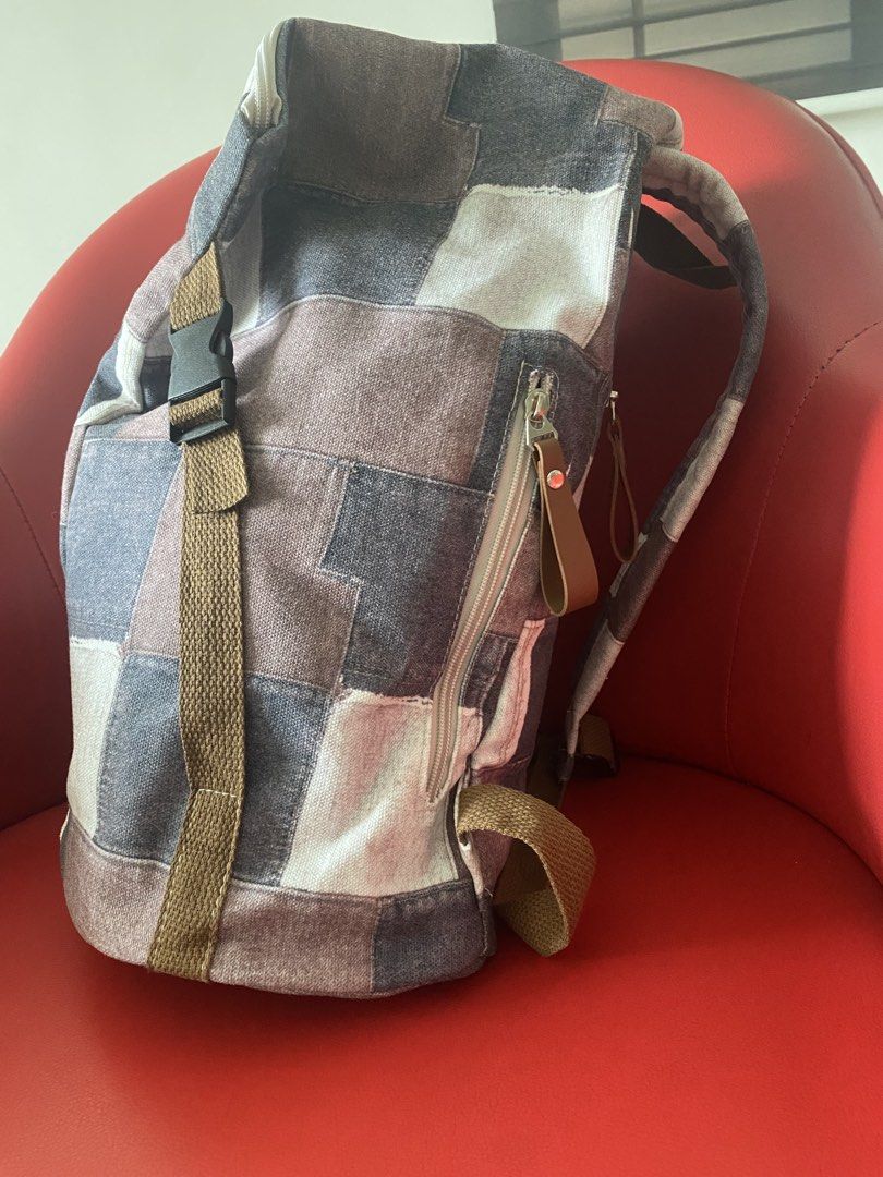 Patchwork Backpack (Category: Backpacks) located in Singapore. Submitted by msgj_mum (Listing ID 1432030788, Image 2). Description: - Stylish patchwork design - Multiple compartments - Adjustable straps - Secure buckle closure - Versatile neutral tones.