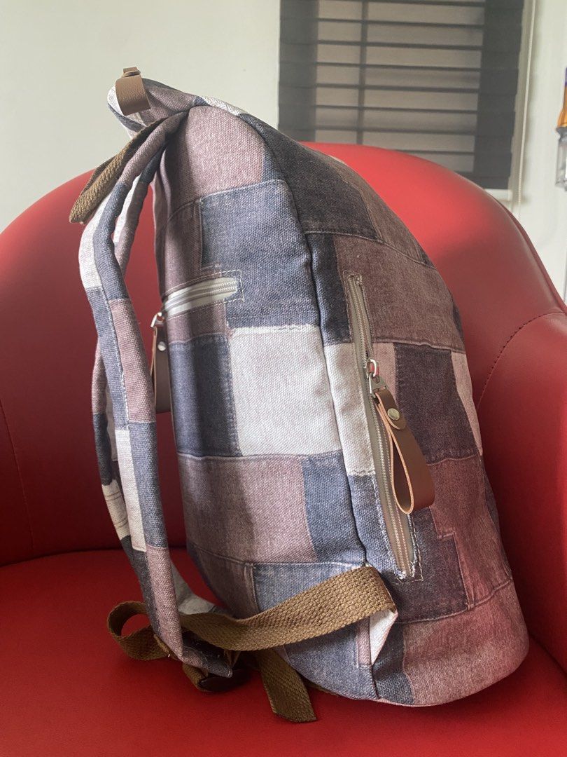 Patchwork Backpack (Category: Backpacks) located in Singapore. Submitted by msgj_mum (Listing ID 1432030788, Image 4). Description: - Stylish patchwork design - Multiple compartments - Adjustable straps - Secure buckle closure - Versatile neutral tones.