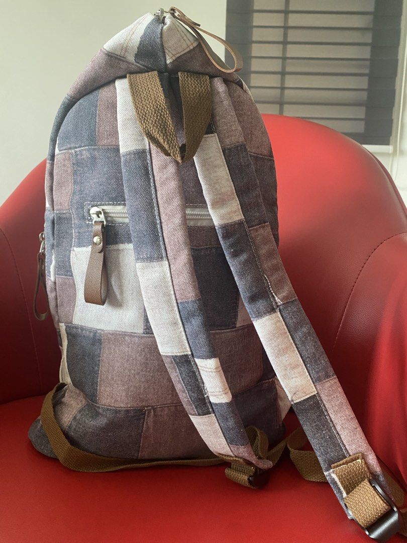 Patchwork Backpack (Category: Backpacks) located in Singapore. Submitted by msgj_mum (Listing ID 1432030788, Image 3). Description: - Stylish patchwork design - Multiple compartments - Adjustable straps - Secure buckle closure - Versatile neutral tones.