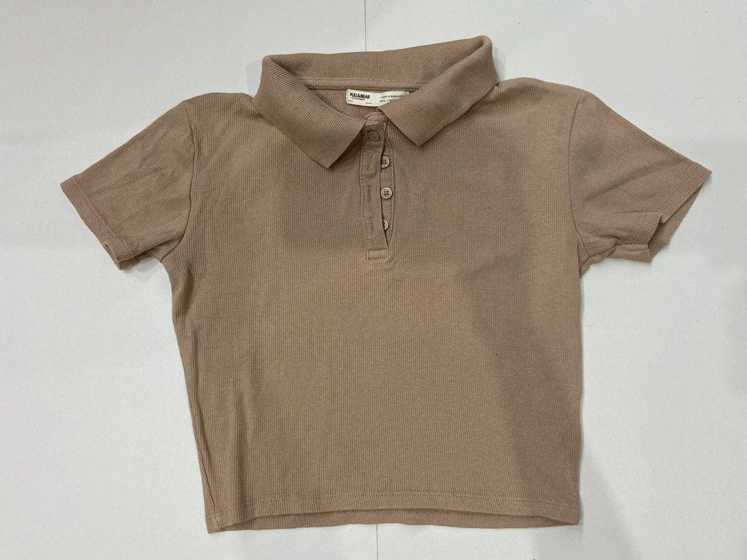 Pull & Bear Collared Top (Category: Other Tops) located in Singapore. Submitted by chocochipbun (Listing ID 1432138152, Image 1). Description: Measurements: Ptp - 38cm/15in Shoulder - 36cm/14in Length - 27cm/15in - Cropped length - Stretchy ribbed material - Selling as can no longer fit Open to negos! Ctb for more enquiries :).