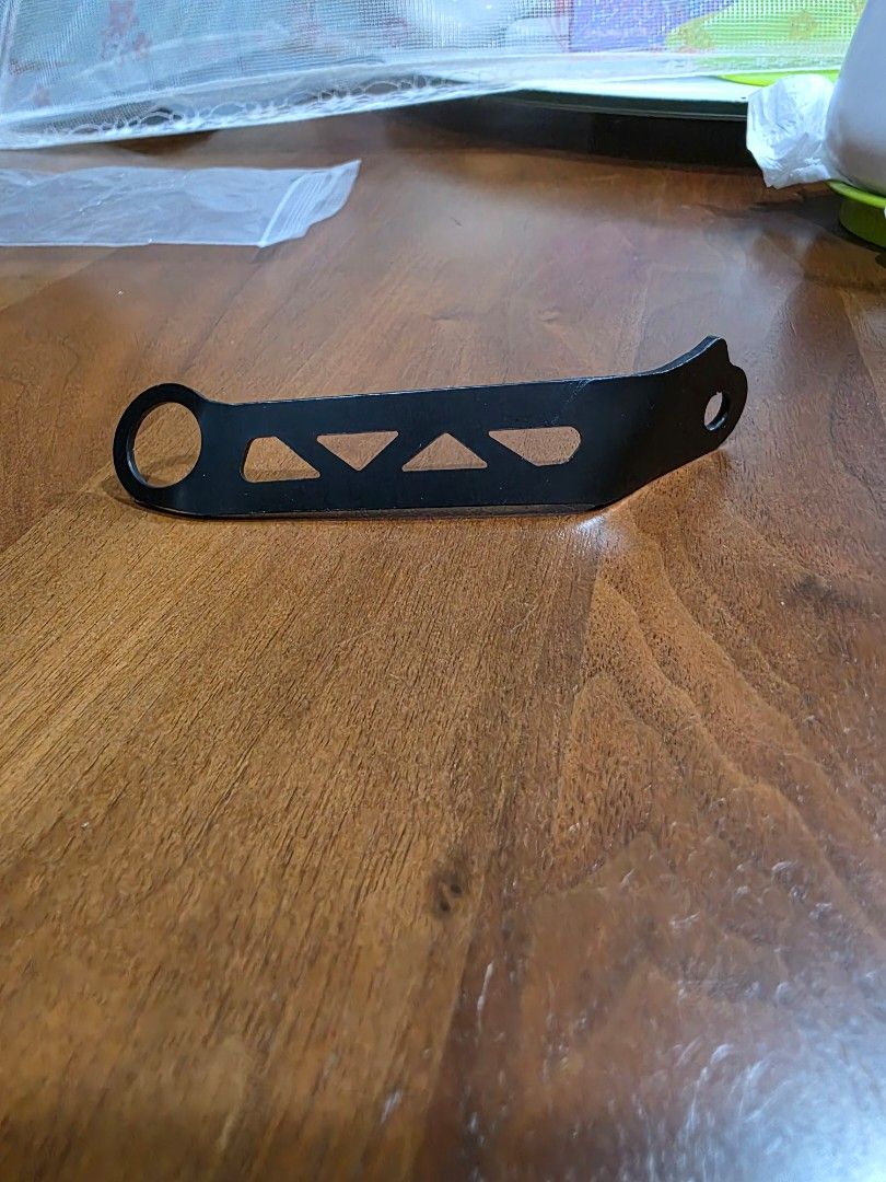 Right Side Bracket (Category: Motorcycle Accessories) located in Singapore. Submitted by seetv (Listing ID 1432192018, Image 3). Description: Brembo brake reservoir bracket. - Right side bracket. - Black color. - Metal construction. - Features a unique cutout design. Self collect at ANCHORVALE CRESCENT..