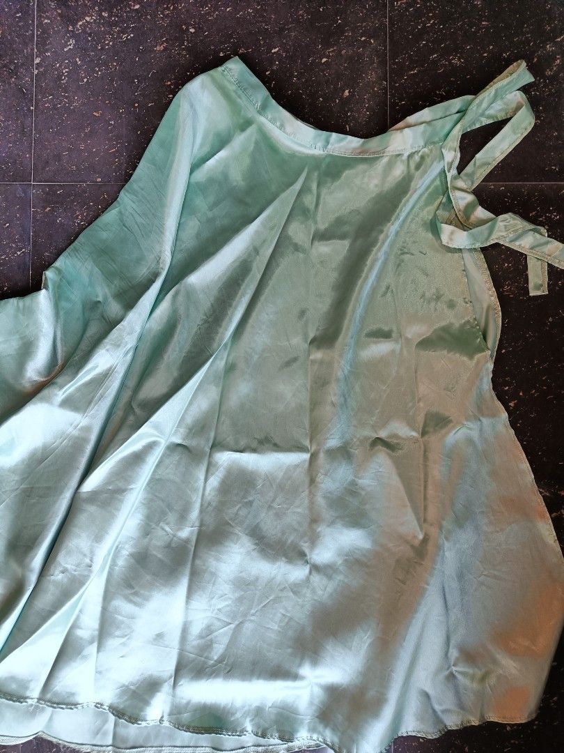 Sage Green Wrap-up Satin skirt (Category: Skirts) located in Orani. Submitted by mbfb_btn (Listing ID 1432056879, Image 2). Description: - Sage green satin skirt - Flowing design - Tie-up details - Subtle sheen - Comfortable feel - Perfect for special occasions or everyday wear.