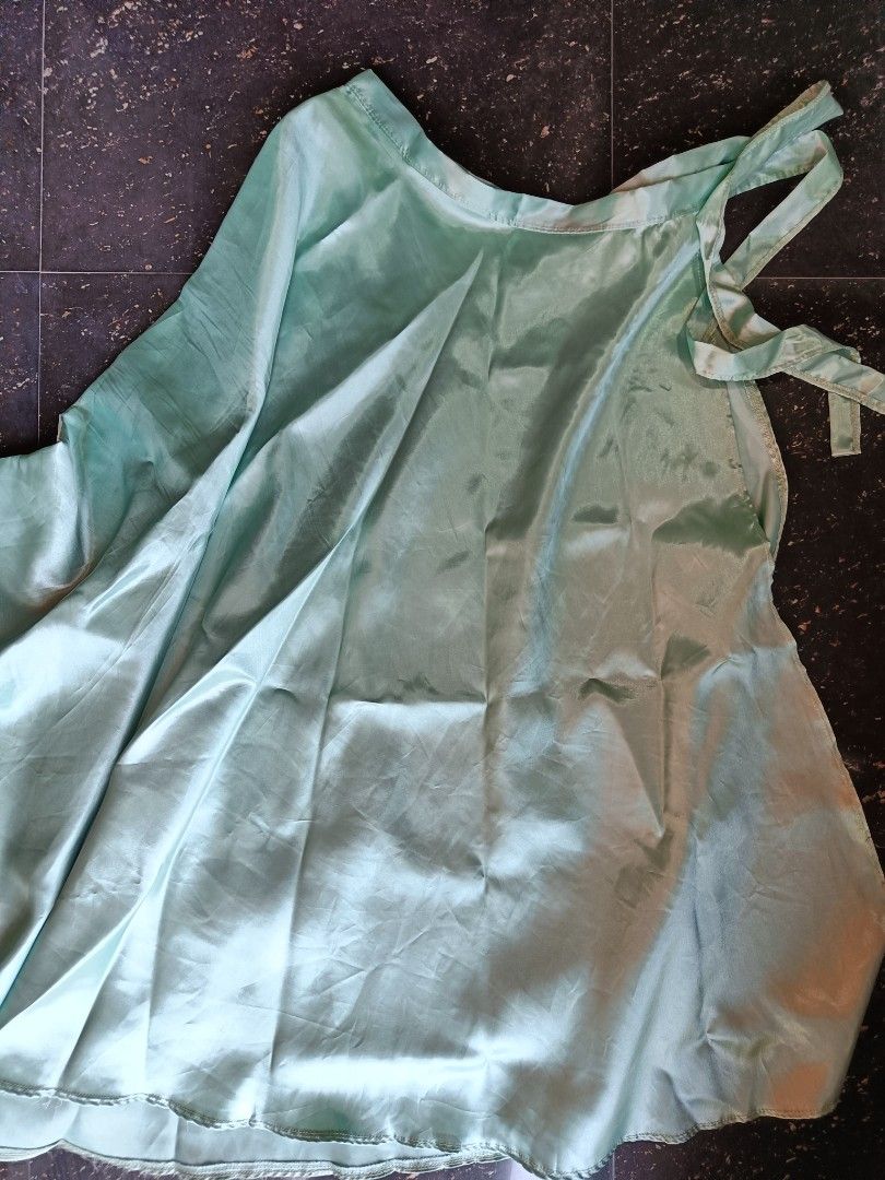 Sage Green Wrap-up Satin skirt (Category: Skirts) located in Orani. Submitted by mbfb_btn (Listing ID 1432056879, Image 3). Description: - Sage green satin skirt - Flowing design - Tie-up details - Subtle sheen - Comfortable feel - Perfect for special occasions or everyday wear.