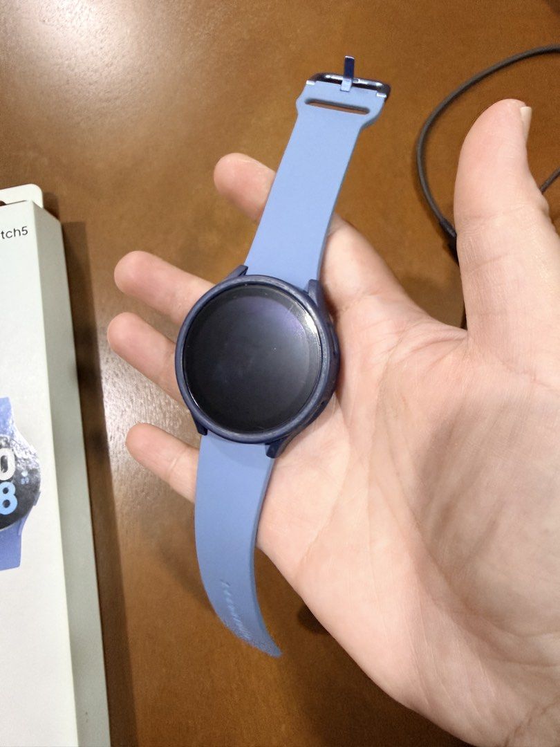 Samsung Galaxy Watch 5 (Category: Wearables & Smart Watches) located in Quezon City. Submitted by decluttererwhenever (Listing ID 1432136624, Image 2). Description: Almost new Seldom used Complete set - watch, original strap, charger, box With screen protector since day 1 SF to be shouldered by the buyer No lowballers please For sale only (not trades).