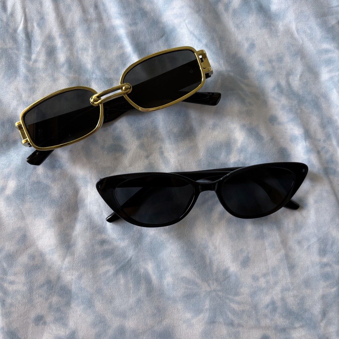 Sunglasses - Gold Frame and Black Cat-Eye (Category: Sunglasses & Eyewear) located in Makati City. Submitted by jinlouise (Listing ID 1432039664, Image 1). Description: - Available: Two stylish sunglasses - 1: Gold frame, rectangular shape - 2: Black cat-eye frame - Features: Dark lenses for sun protection - Benefits: Adds a stylish touch to your look Take 2 for 189.
